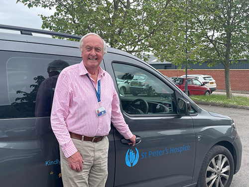 John with a St Peter's Hospice vehicle