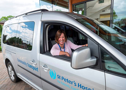 Pam with a St Peter's Hospice vehicle